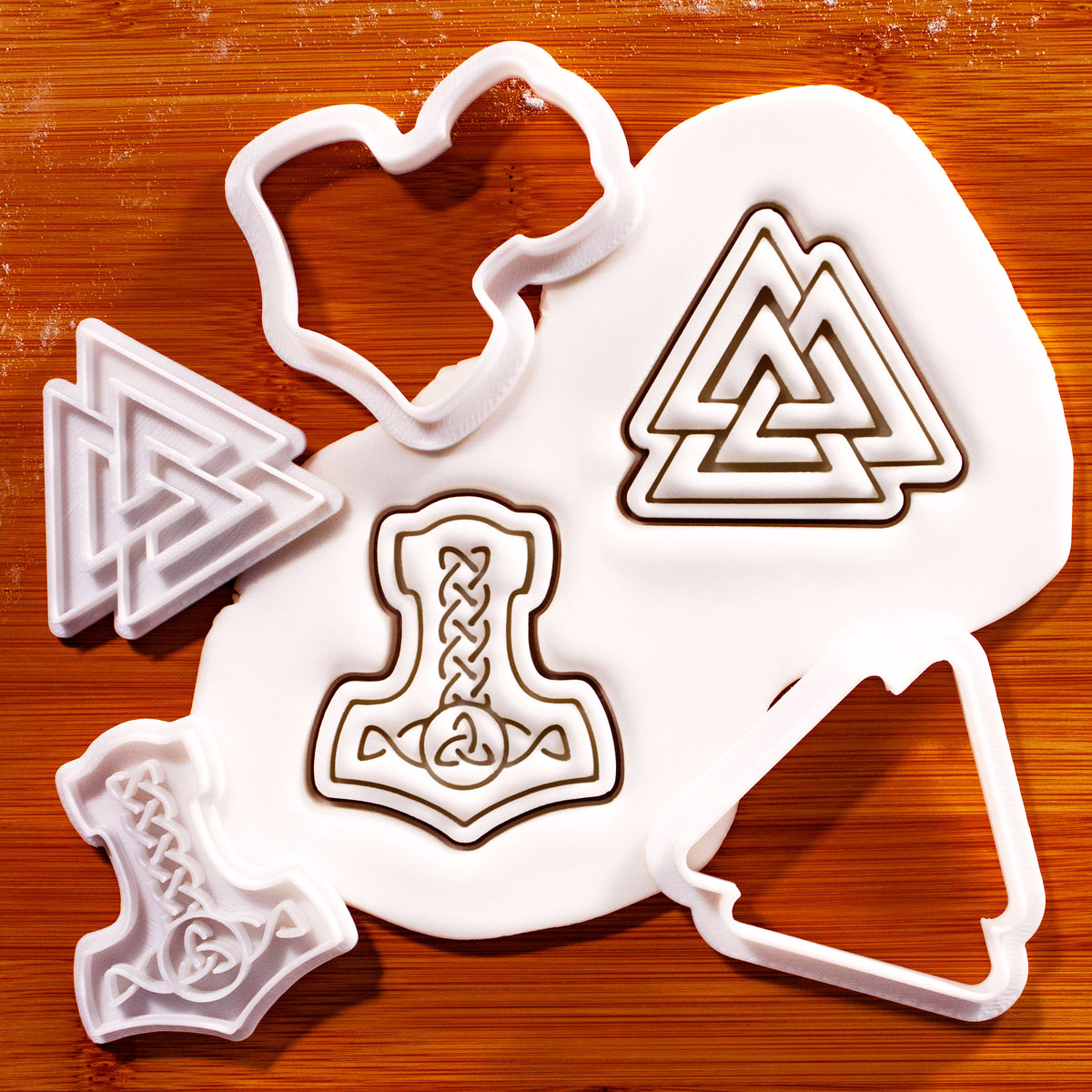 Mjolnir and Valknut mini cookie cutter and stamp set on fondant showing both Viking designs