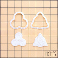 Triskelion and Celtic Triquetra mini cookie cutter and stamp set on inch grid for size reference