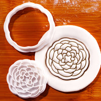 Detailed Camellia flower cookie cutter and stamp pressed into fondant