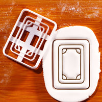 White Dragon mahjong cookie cutter and stamp pressing tile design into fondant
