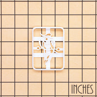 Large 1 Bamboo mahjong cookie cutter shown on inch measurement grid