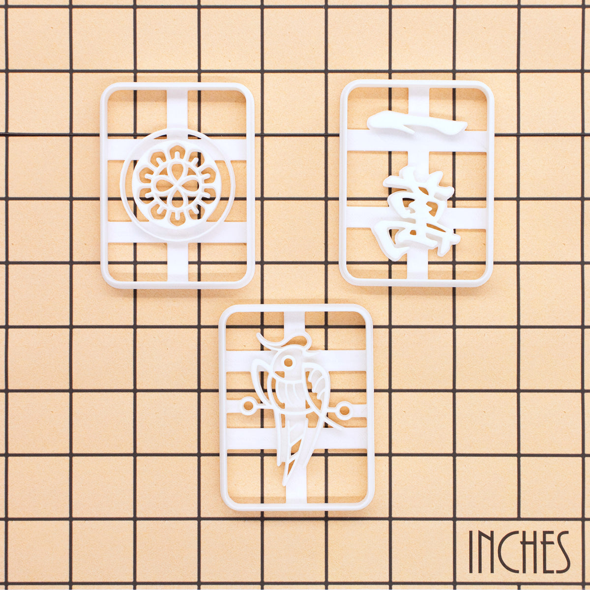 Large mahjong cookie cutters shown on inch measurement grid in a set of 3