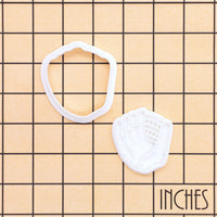 Softball glove mini cookie cutter and stamp set shown on inch measurement grid