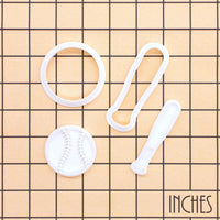 Softball and bat mini cookie cutter and stamp set shown on inch measurement grid