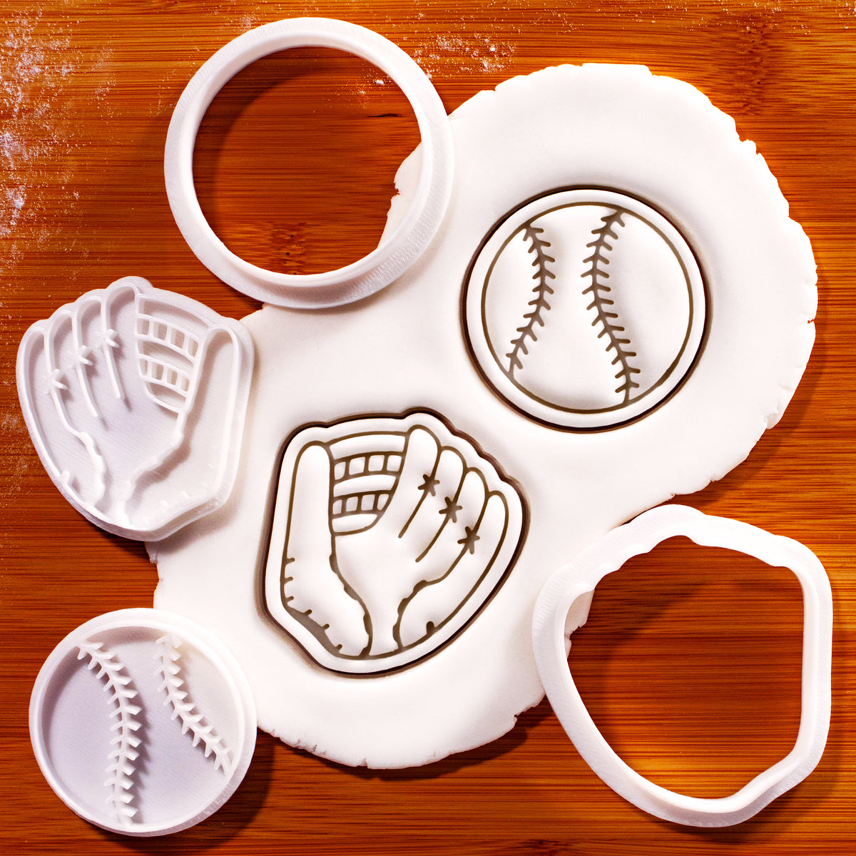 Softball and glove mini cookie cutter and stamp set shown with stamped fondant