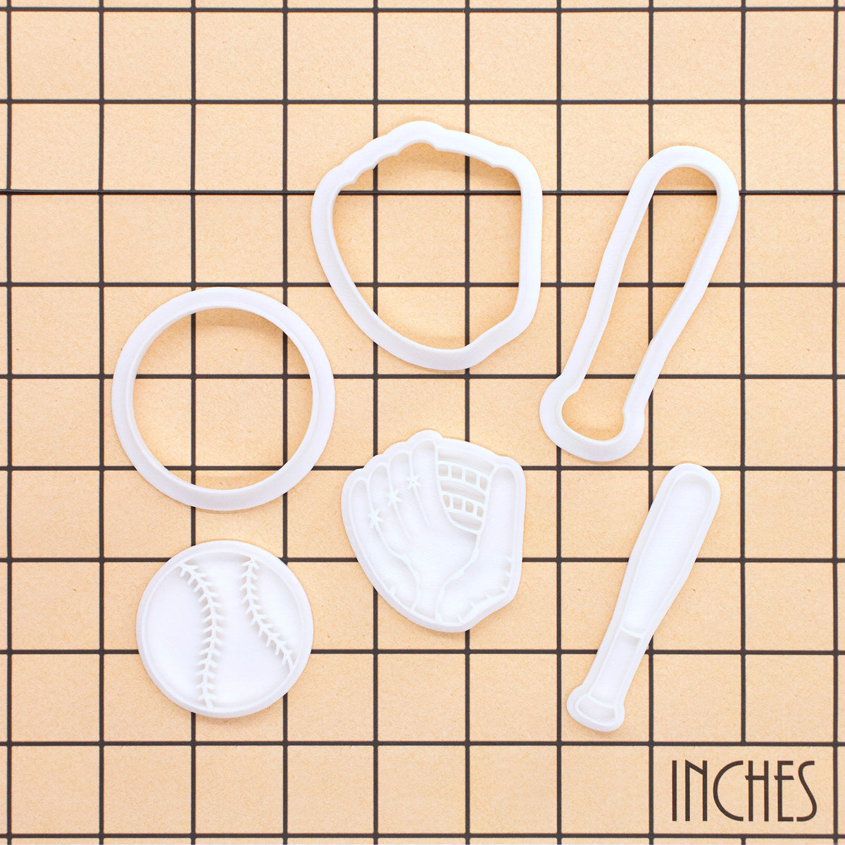 Softball bat and glove mini cookie cutter and stamp set shown on inch measurement grid