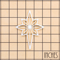 Star of Bethlehem Christmas cookie cutter shown on inch measurement grid for size reference