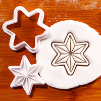 6-point star mini cookie cutter and stamp set with geometric star impression in fondant