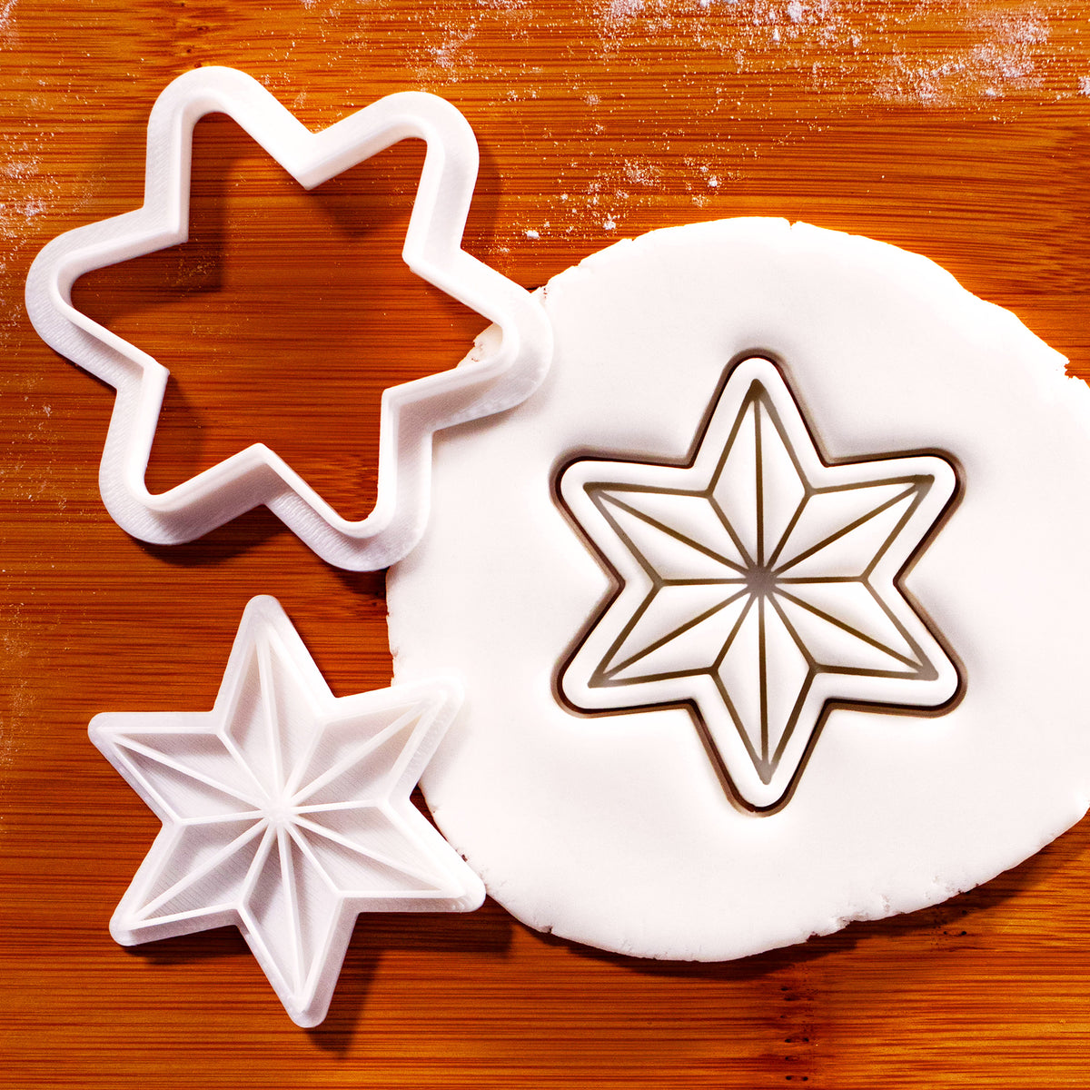 6-point star mini cookie cutter and stamp set with geometric star impression in fondant