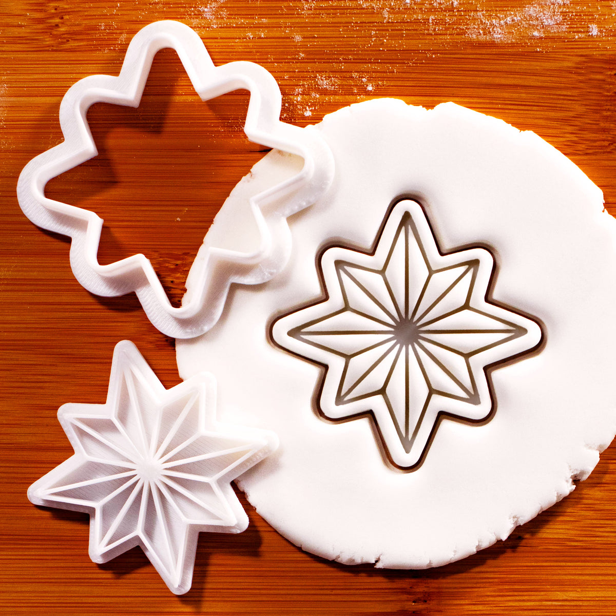 8-point star mini cookie cutter and stamp set with geometric star impression in fondant