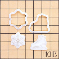 Ice skate and snowflake mini cookie cutter and stamp set of 2 shown on inch grid for size reference