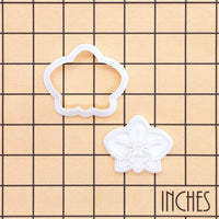 Orchid flower mini cookie cutter and stamp set shown on inch grid for size reference