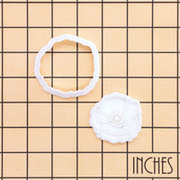 Poppy flower mini cookie cutter and stamp set shown on inch grid for size reference
