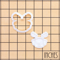 Puppy reindeer mini cookie cutter and stamp set shown on inch grid for size reference