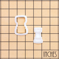 Rook chess mini cookie cutter and stamp shown on inch grid for size reference
