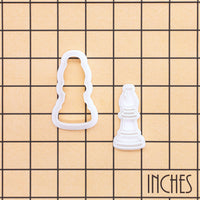 Bishop chess mini cookie cutter and stamp shown on inch grid for size reference