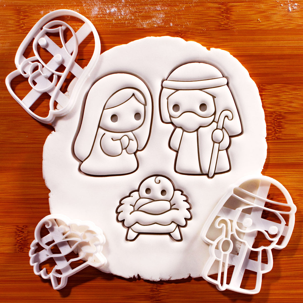 Set of 3 cute Nativity cookie cutters featuring Mary, Joseph and baby Jesus in a manger for Christmas baking