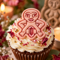 Pink Sheela Na Gig fondant cupcake topper with detailed stamped Irish folklore figure