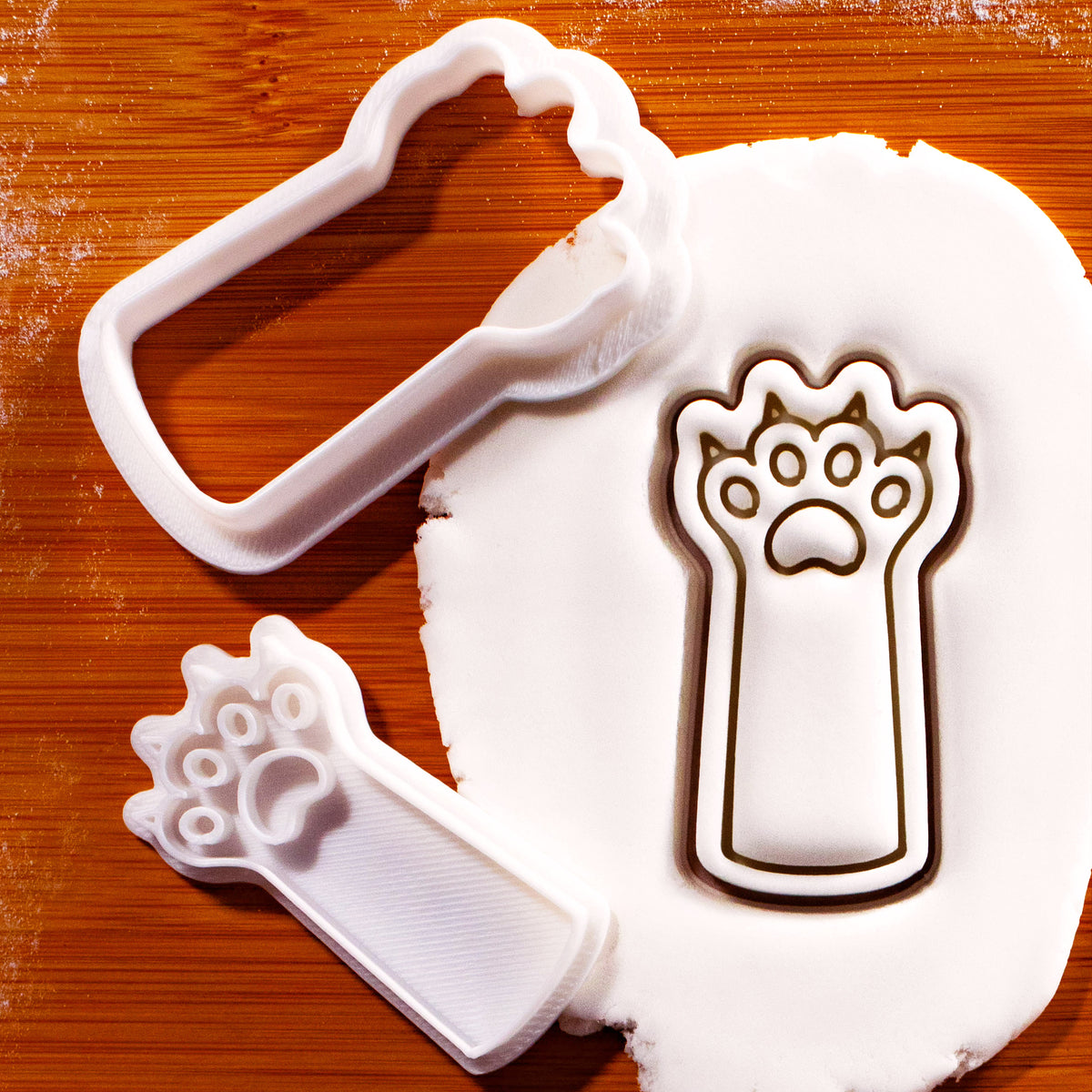 Kitty paw claws mini 2-piece cookie cutter and detail stamp pressed into white fondant