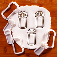 Rock Paper Scissors kitty paw mini cookie cutters and stamps pressed into white fondant