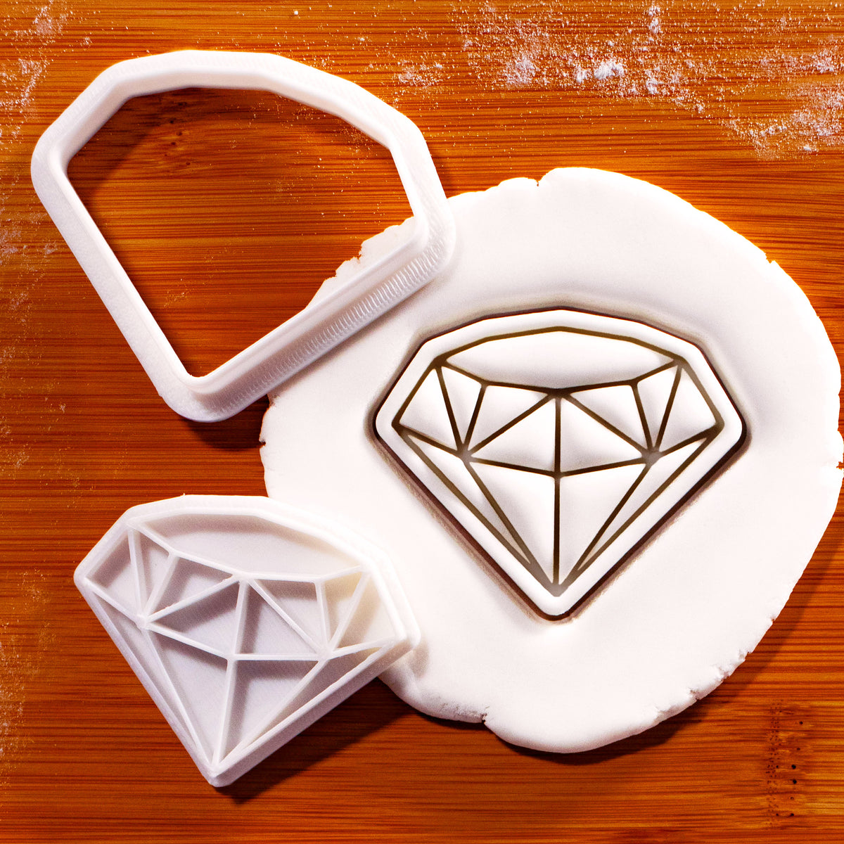 Diamond mini cookie cutter and detail stamp pressed into white fondant