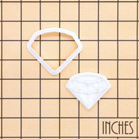 Diamond mini cookie cutter and stamp shown on inch measurement grid