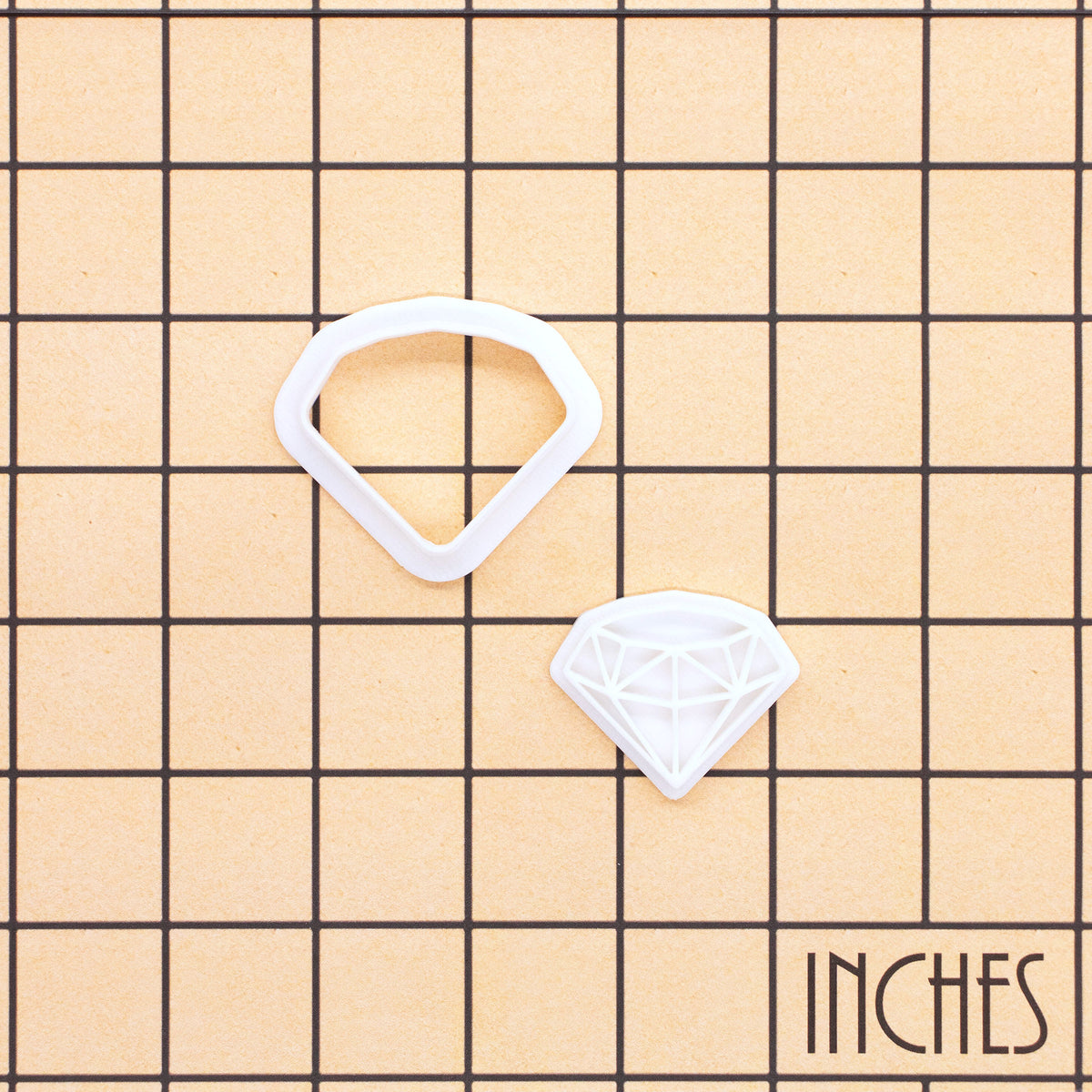 XS diamond mini cookie cutter and stamp shown on inch measurement grid
