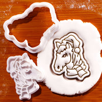 Christmas horse head mini cookie cutter and detail stamp with fondant impression on wooden board