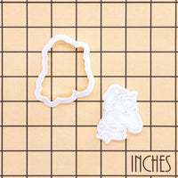 Christmas horse head mini outline cutter and detail stamp shown on inch measurement grid