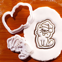 Happy Christmas cat mini cookie cutter and stamp with Santa hat pressed into fondant