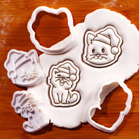 Christmas cats mini cookie cutter and stamp set of 2 with cat face and happy cat designs pressed into fondant