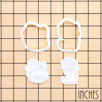 Christmas cats mini outline cutters and detail stamps shown on inch measurement grid