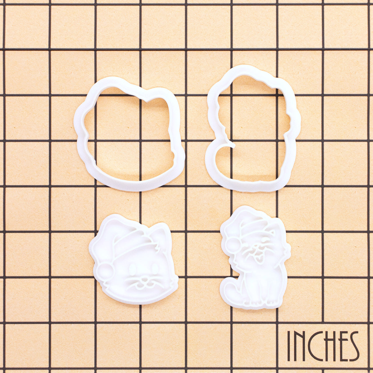 Christmas cats mini outline cutters and detail stamps shown on inch measurement grid