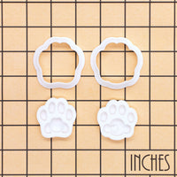 Set of 2 kitty paw mini cookie cutters and stamps in cute and realistic designs shown on inch measurement grid