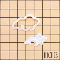 Christmas humpback whale mini cookie cutter and detail stamp on an inch size grid
