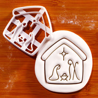 Nativity scene cookie cutter with built-in Holy Family detail and stamped sugarpaste impression