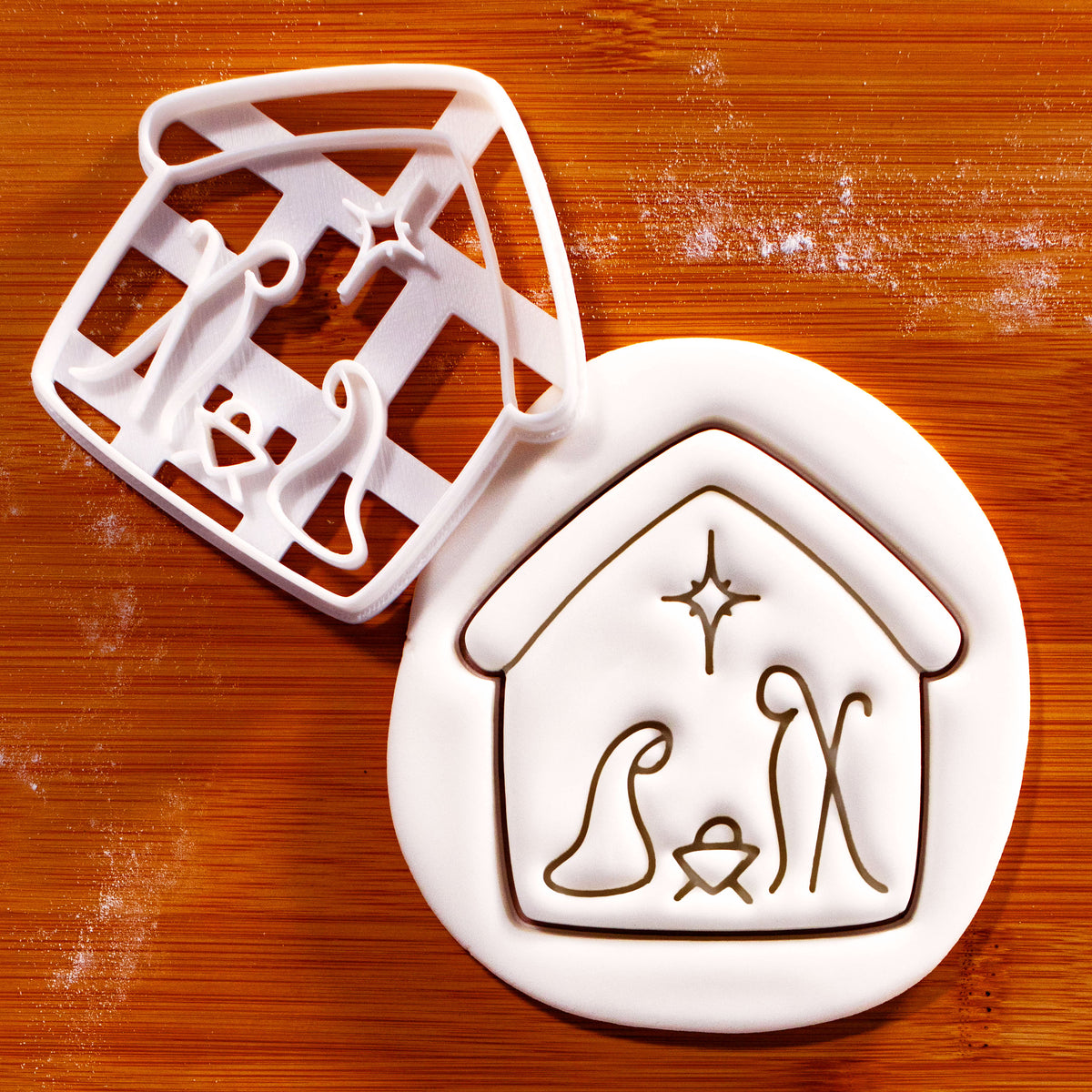Nativity scene cookie cutter with built-in Holy Family detail and stamped sugarpaste impression