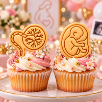 Foetus and placenta mini biscuits used as cupcake toppers for pregnancy and midwife themed baking