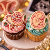 Decorated foetus and placenta sugarpaste cupcake toppers for baby shower and maternity themed cakes