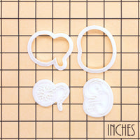 20-week foetus and placenta mini cookie cutters and stamps shown on inch measurement grid