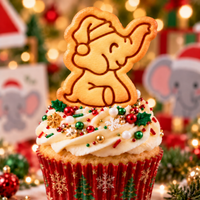 Christmas baby elephant Santa hat biscuit used as festive cupcake topper