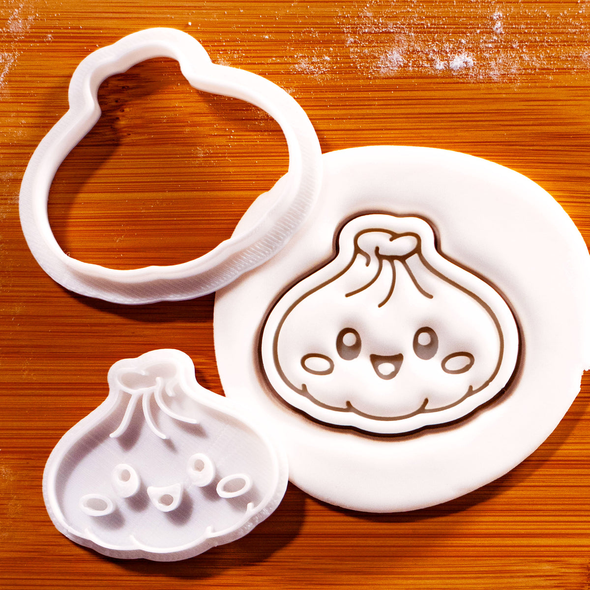 Kawaii Xiao Long Bao dumpling mini cookie cutter and stamp beside embossed sugarpaste impression