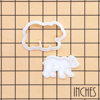 Christmas polar bear mini cookie cutter and stamp set shown on inch measurement grid