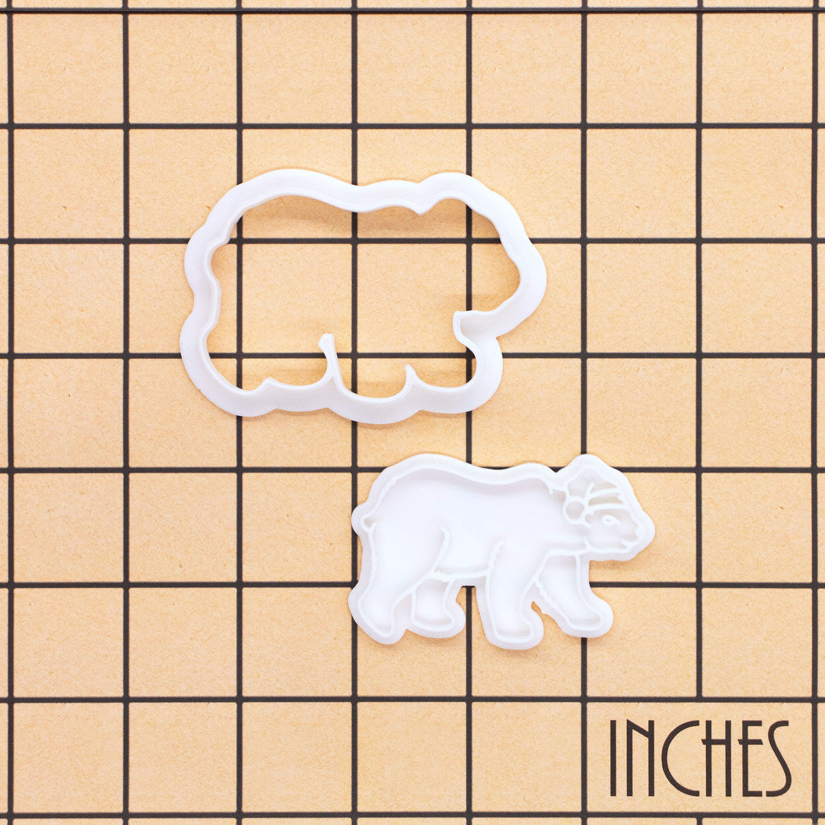 Christmas polar bear mini cookie cutter and stamp set shown on inch measurement grid