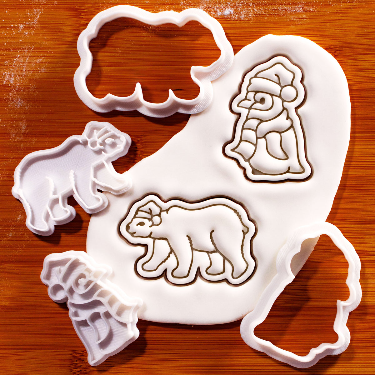Xmas polar bear and baby penguin mini cookie cutters and detailed stamps with embossed sugarpaste impressions