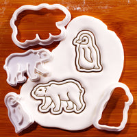 Polar bear and baby penguin mini cookie cutters and stamps with embossed sugarpaste impressions