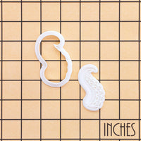 Octopus tentacles mini cookie cutter and detailed suction cup stamp shown on inch measurement grid