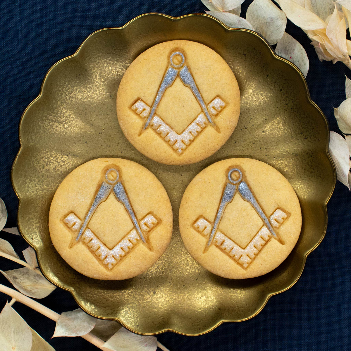 masonic cookies with hand painted edible food coloring on the compasses and ruler