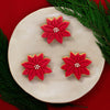 Poinsettia Flower cookies with fondant and chocolate balls on top