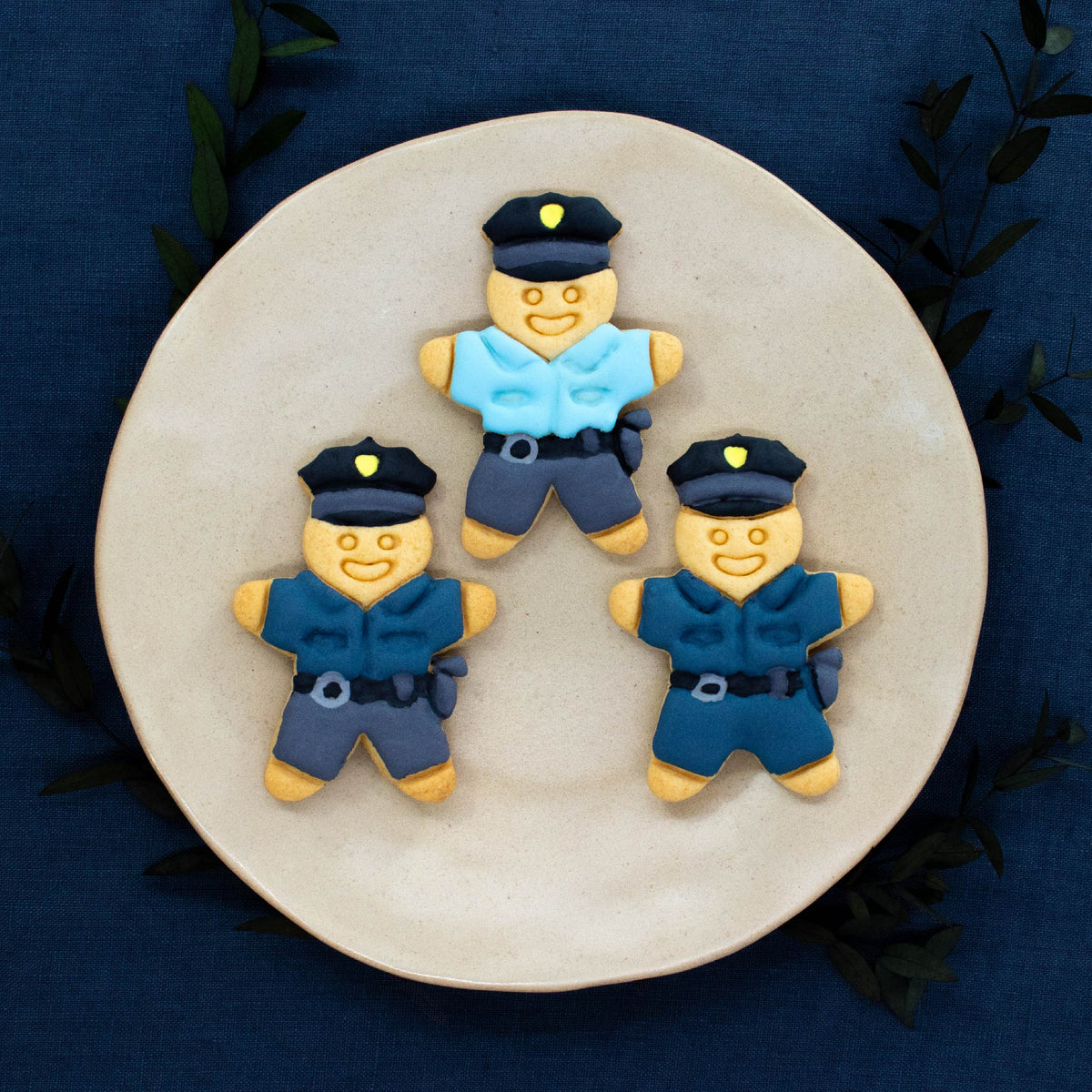 Police officer cookies colored with royal icing made with bakerlogy police officer cookie cutter